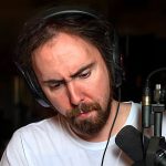 Asmongold looks at the camera.