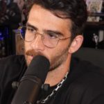 hasan in front of a plant while streaming on twitch