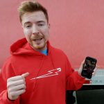 MrBeast pointing hand at camera in blue shirt while IShowSpeed holds chin in car seat