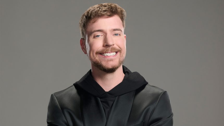 A photo of MrBeast against a wall of dollar signs.