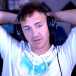 Ninja seeming distressed against a background of dollar signs.