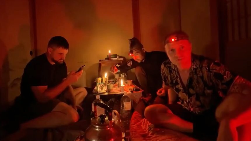 Sam and Colby on a background of skulls and bones.