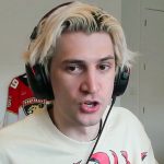 xqc wearing a grey hoodie streaming on twitch