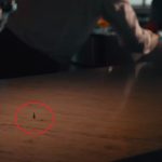 a man eating chicken from a kfc vending machine