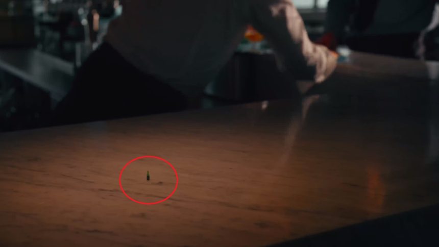 a man eating chicken from a kfc vending machine