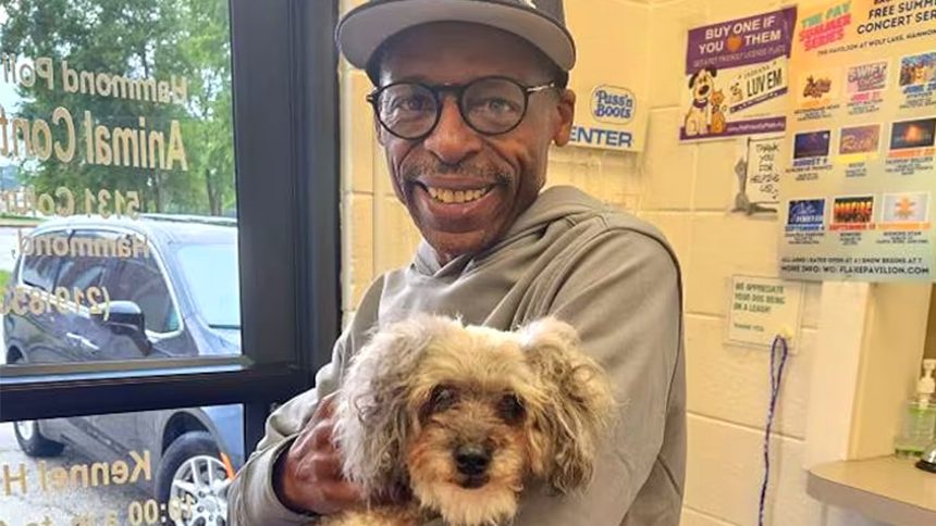 Hasan holds his dog, Kaya.