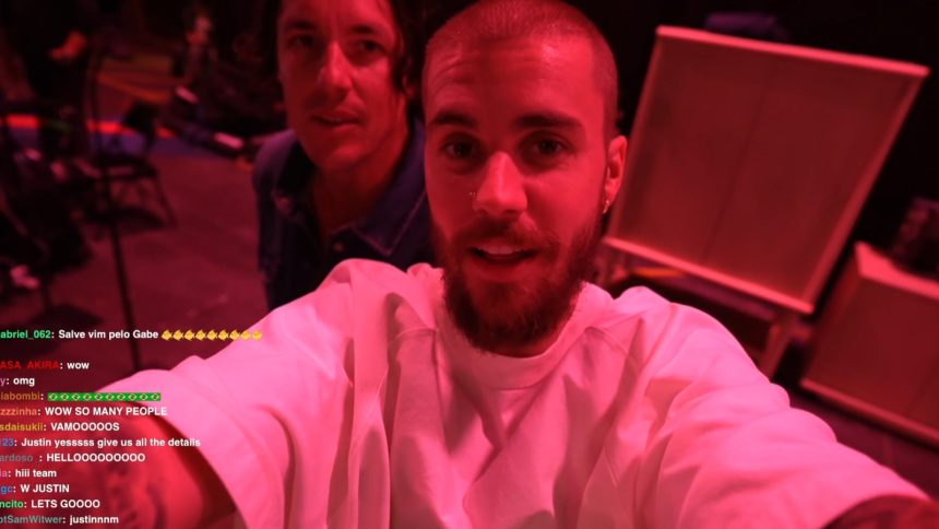 A mom embraces her son after he opens his first paycheck.