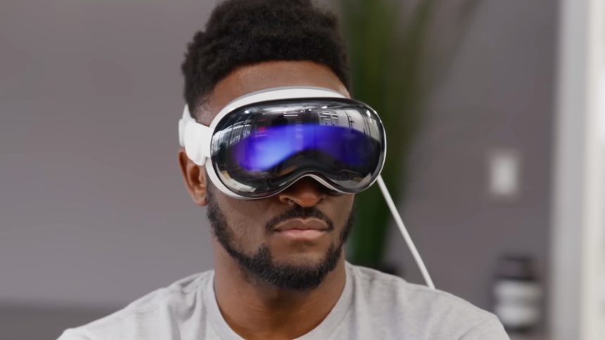 MKBHD holding Apple AirPods Pro 3 in hand
