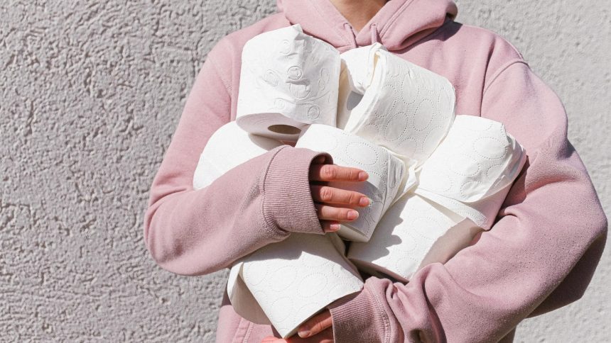 Two women use their smartphones while wearing kimono in Japan.