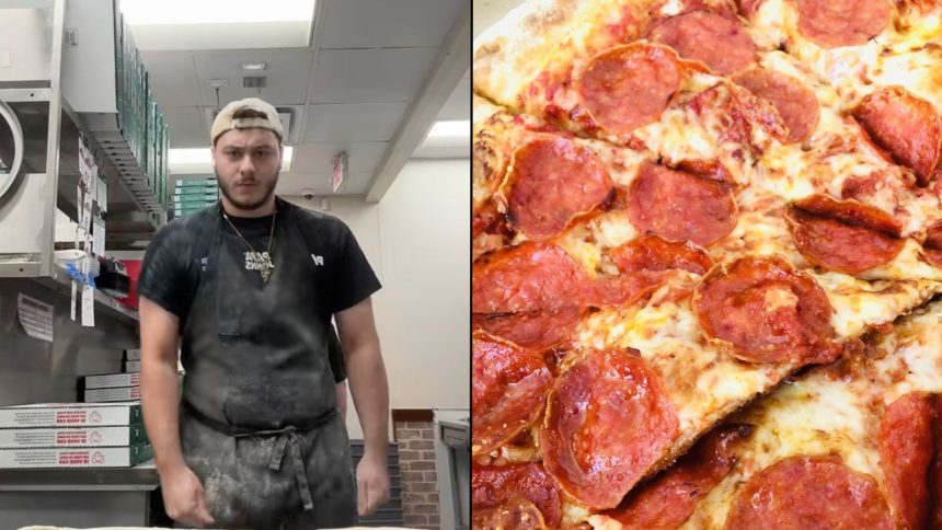 Woman biting into a sandwich while squinting her eyes