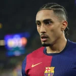 Why is Raphinha not playing for Barcelona vs. PSG in the UEFA Champions League?