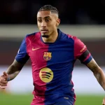 Why isn't Raphinha playing for Barcelona against Olympiacos in UEFA Champions League?