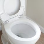 IShowSpeed holding hands together in back of car