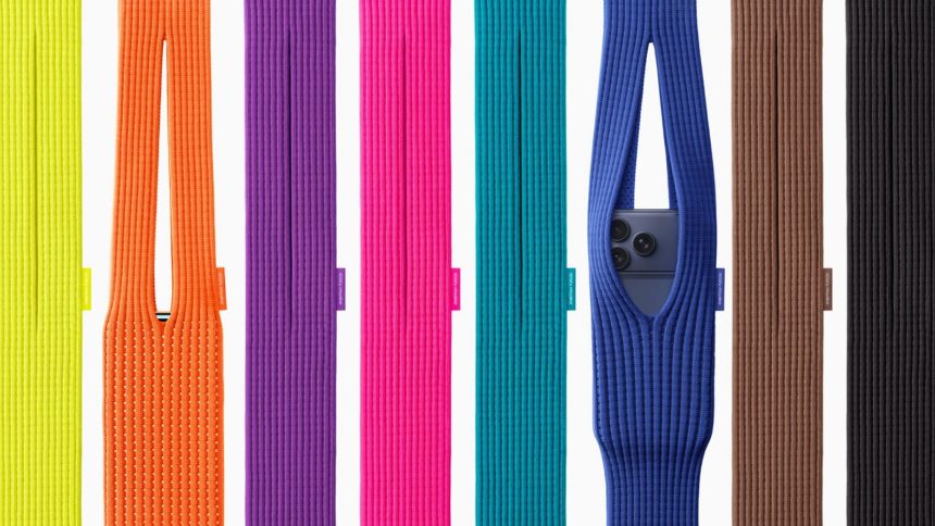 Man with glasses sat scrolling on iphone