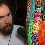 asmongold in a white shirt staring at the camera in his staring room
