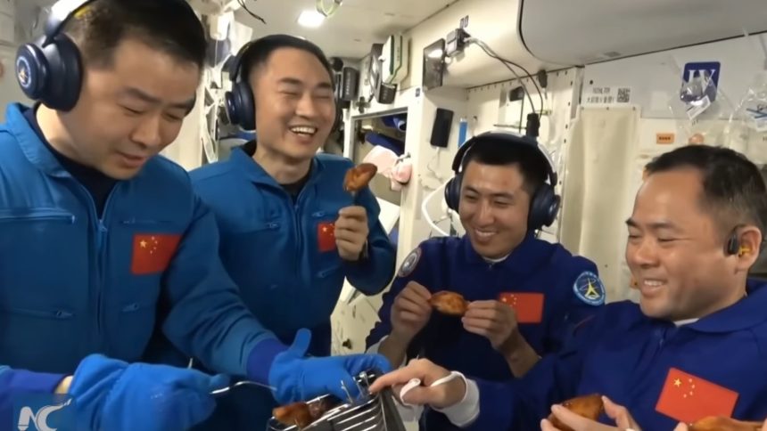 a man eating chicken from a kfc vending machine