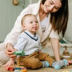 A cute baby looks sideways.