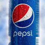 Bags of Lay's potato chips at a grocery store.