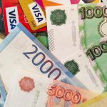 Ariel signs away her soul in The Little Mermaid next to a grinning Labubu doll.