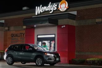 Screenshots of white castle drive-thru menu with $15,000 cost on screen