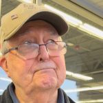 IShowSpeed standing next to older woman rubbing hands