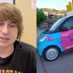 A photo of MrBeast against a background of dollar signs.