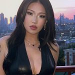 A photo of Chierri posing at her booth at TwitchCon 2025.