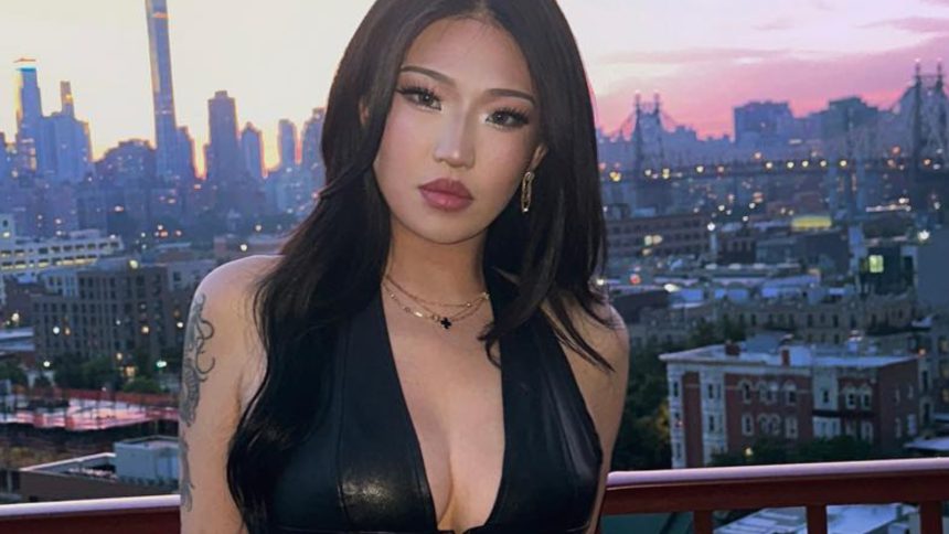 A photo of Chierri posing at her booth at TwitchCon 2025.