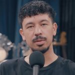 Drake and Bobbi Althoff looking at each other while laying on bed