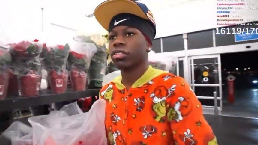 A photo of Chierri posing at her booth at TwitchCon 2025.