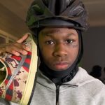 A photo of Sliker on top of the Twitch logo.