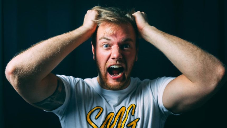 Blonde child shouting 67 at camera