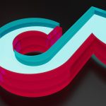 The TikTok logo against a dark background.