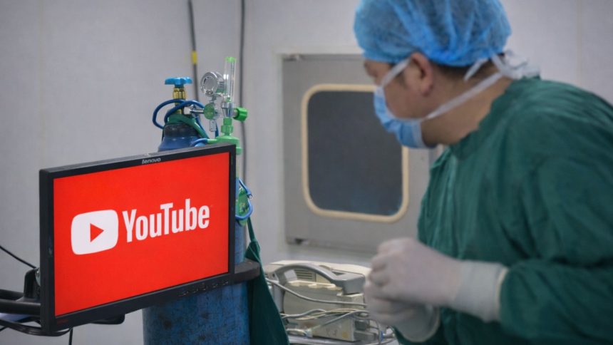 surgeon watching youtube video