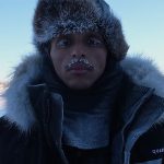 A photo of Agent in the North Pole with frosty eyelashes and facial hair.