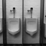 A photo of urinals in a public bathroom.