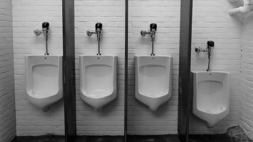 A photo of urinals in a public bathroom.