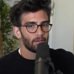 hasan in front of a plant while streaming on twitch