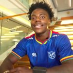 IShowSpeed sat on stairs in blue shirt talking to camera