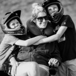 sara bennett with her children in a black and white photo