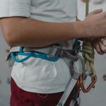 Climber next to a climbing wall