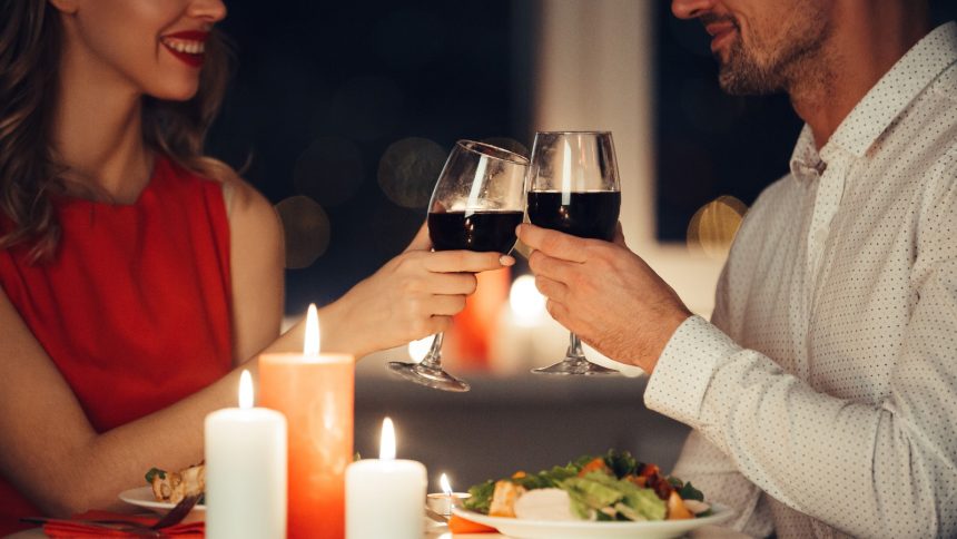 couple on date night drinking wine at restaurant