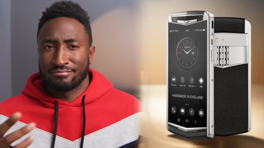 Marques Brownlee next to the Virtu Agent Q phone