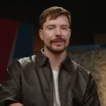 MrBeast talking to camera in leather jacket