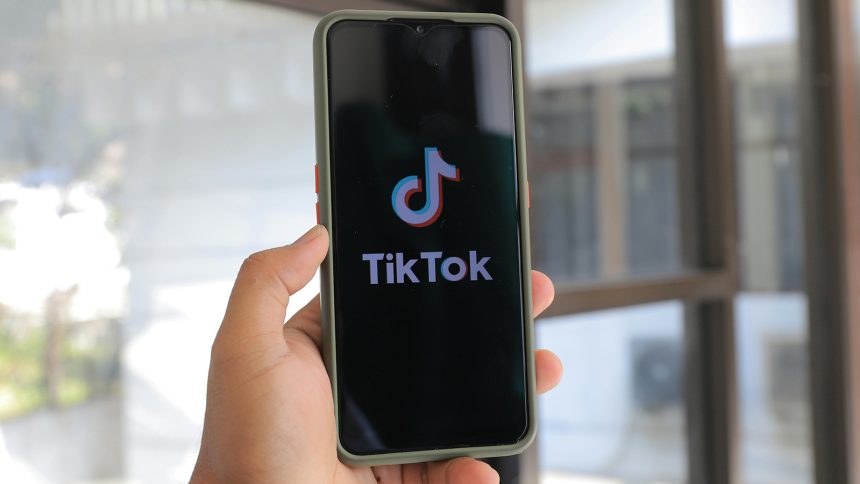 TikTok logo on a phone