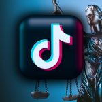 The TikTok logo in front of Justice holding her scales.