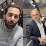 TraxNYC talking to camera and stood next to Akay Diamonds