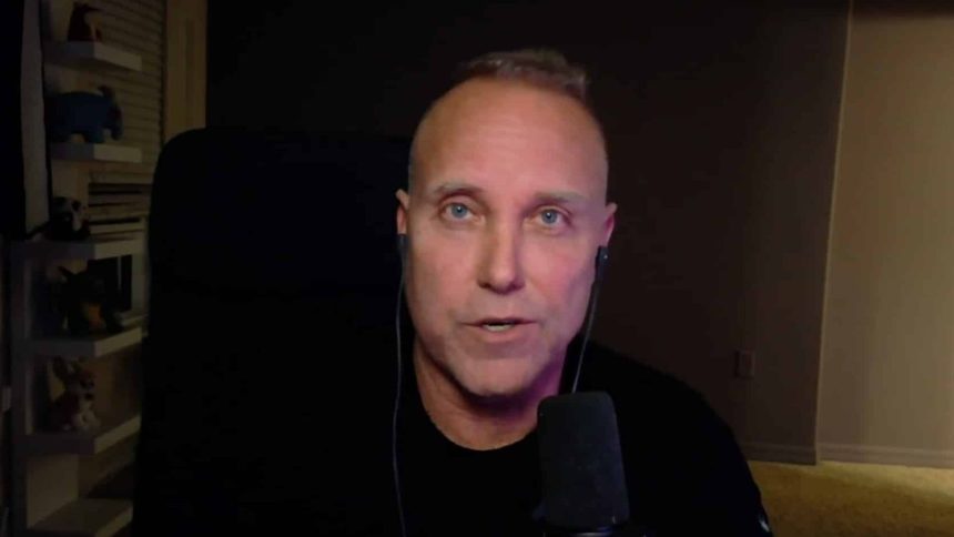 Swifty sat in black t-shirt talking to camera