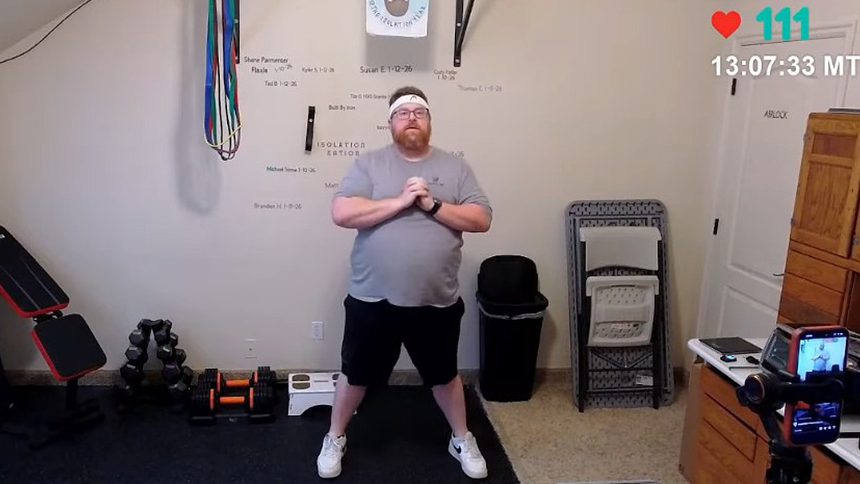 A photo of YouTuber Skip, aka The Isolation Year, working out on stream.