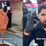Man holding hand up with burger inside